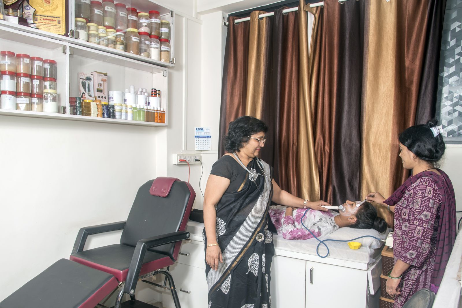 Mrs. Nikita Gujarathi giving a skin treatment at Touch and Glow